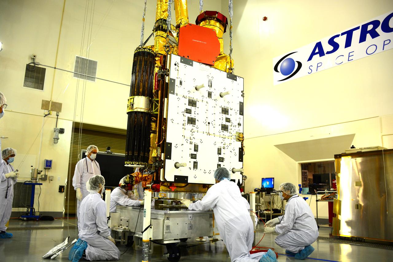 Inside the Astrotech payload processing facility on Vandenberg Air Force Base in California, engineers and technicians mount NASA's Soil Moisture Active Passive, or SMAP, spacecraft on a work platform. SMAP will launch on a Delta II 7320 configuration vehicle featuring a United Launch Alliance first stage booster powered by an Aerojet Rocketdyne RS-27A main engine and three Alliant Techsystems, or ATK, strap-on solid rocket motors. Once on station in Earth orbit, SMAP will provide global measurements of soil moisture and its freeze/thaw state. These measurements will be used to enhance understanding of processes that link the water, energy and carbon cycles, and to extend the capabilities of weather and climate prediction models. SMAP data also will be used to quantify net carbon flux in boreal landscapes and to develop improved flood prediction and drought monitoring capabilities. Launch from Space Launch Complex 2 is targeted for Jan. 29, 2015.