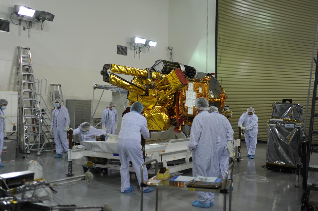 Inside the Astrotech payload processing facility on Vandenberg Air Force Base in California, engineers and technicians begin processing of NASA's Soil Moisture Active Passive, or SMAP, spacecraft. SMAP will launch on a Delta II 7320 configuration vehicle featuring a United Launch Alliance first stage booster powered by an Aerojet Rocketdyne RS-27A main engine and three Alliant Techsystems, or ATK, strap-on solid rocket motors. Once on station in Earth orbit, SMAP will provide global measurements of soil moisture and its freeze/thaw state. These measurements will be used to enhance understanding of processes that link the water, energy and carbon cycles, and to extend the capabilities of weather and climate prediction models. SMAP data also will be used to quantify net carbon flux in boreal landscapes and to develop improved flood prediction and drought monitoring capabilities. Launch from Space Launch Complex 2 is targeted for Jan. 29, 2015. 