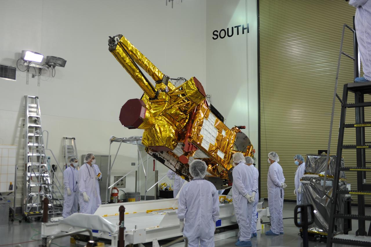 Inside the Astrotech payload processing facility on Vandenberg Air Force Base in California, engineers and technicians rotate NASA's Soil Moisture Active Passive, or SMAP, spacecraft to begin processing. SMAP will launch on a Delta II 7320 configuration vehicle featuring a United Launch Alliance first stage booster powered by an Aerojet Rocketdyne RS-27A main engine and three Alliant Techsystems, or ATK, strap-on solid rocket motors. Once on station in Earth orbit, SMAP will provide global measurements of soil moisture and its freeze/thaw state. These measurements will be used to enhance understanding of processes that link the water, energy and carbon cycles, and to extend the capabilities of weather and climate prediction models. SMAP data also will be used to quantify net carbon flux in boreal landscapes and to develop improved flood prediction and drought monitoring capabilities. Launch from Space Launch Complex 2 is targeted for Jan. 29, 2015. 