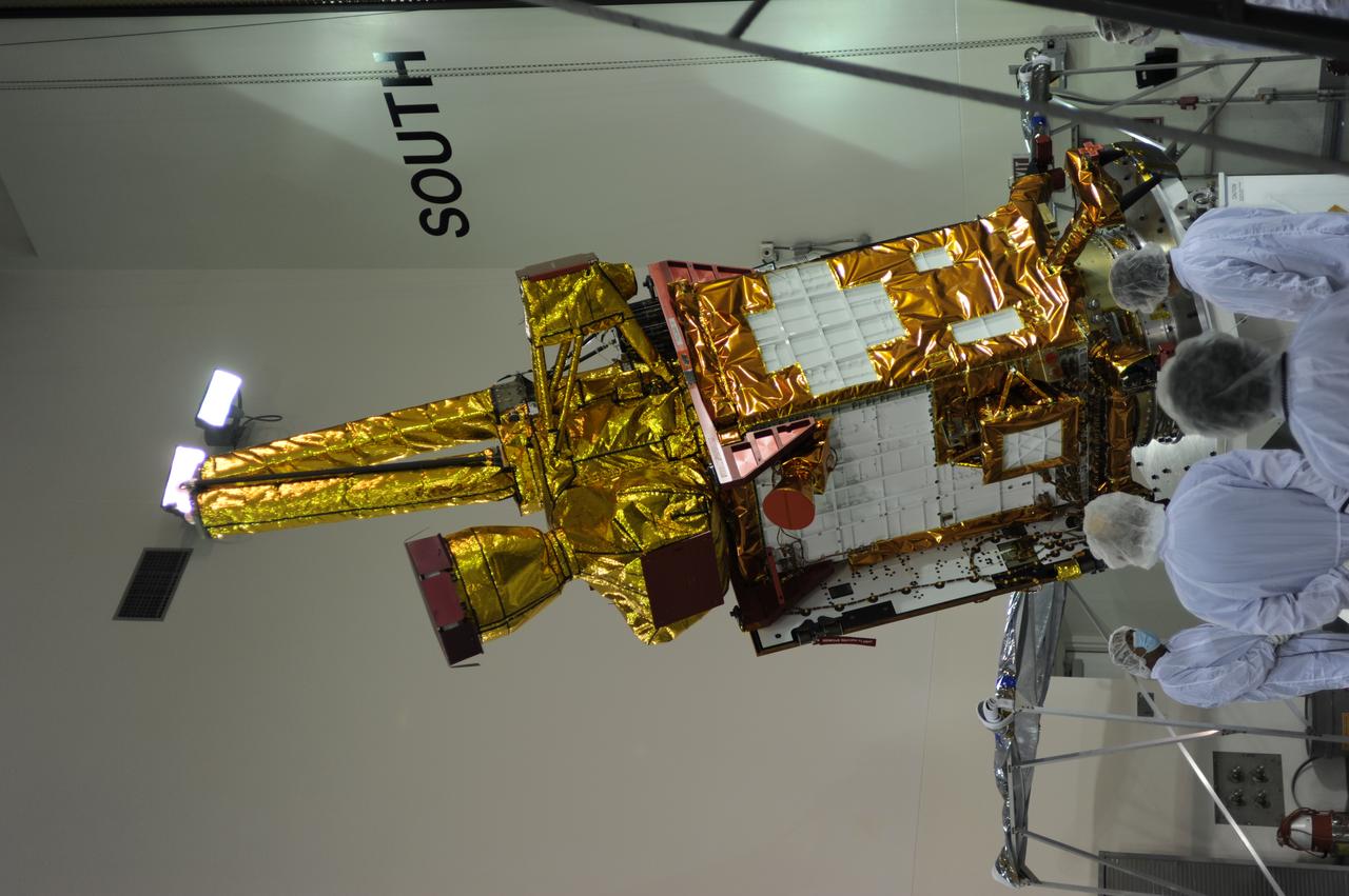 Inside the Astrotech payload processing facility on Vandenberg Air Force Base in California, engineers and technicians rotate NASA's Soil Moisture Active Passive, or SMAP, spacecraft to begin processing. SMAP will launch on a Delta II 7320 configuration vehicle featuring a United Launch Alliance first stage booster powered by an Aerojet Rocketdyne RS-27A main engine and three Alliant Techsystems, or ATK, strap-on solid rocket motors. Once on station in Earth orbit, SMAP will provide global measurements of soil moisture and its freeze/thaw state. These measurements will be used to enhance understanding of processes that link the water, energy and carbon cycles, and to extend the capabilities of weather and climate prediction models. SMAP data also will be used to quantify net carbon flux in boreal landscapes and to develop improved flood prediction and drought monitoring capabilities. Launch from Space Launch Complex 2 is targeted for Jan. 29, 2015.