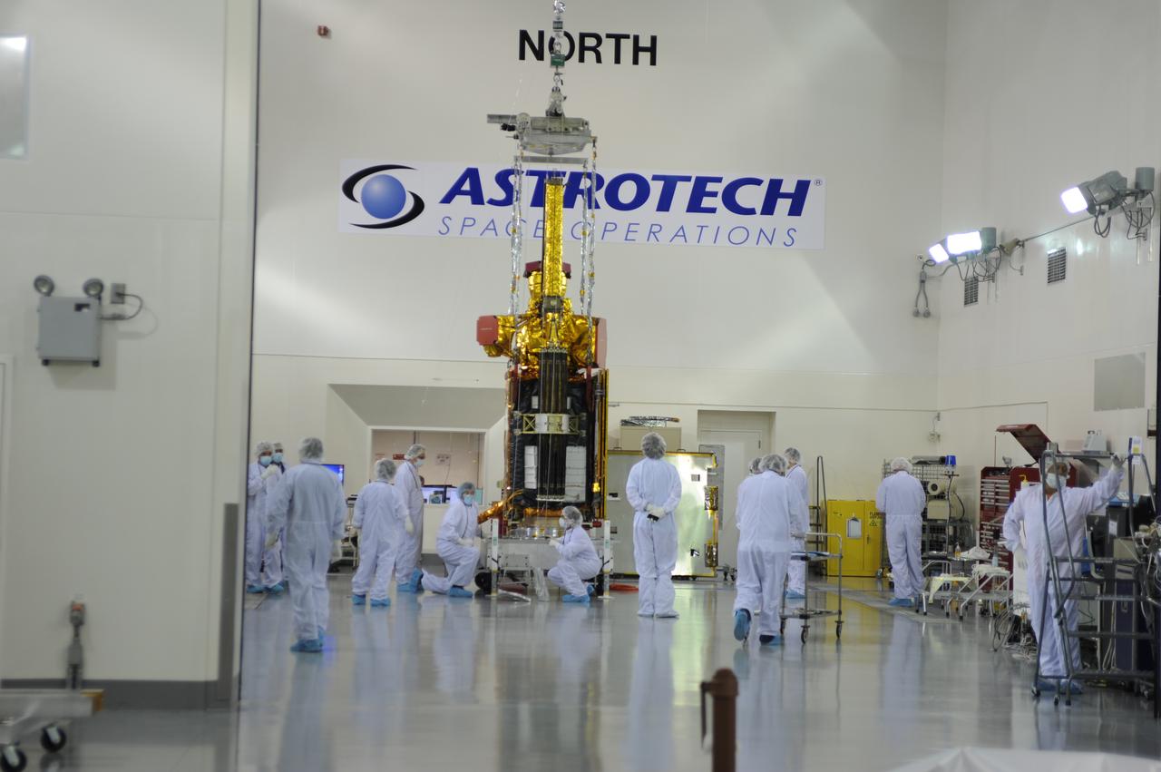 Inside the Astrotech payload processing facility on Vandenberg Air Force Base in California, engineers and technicians inspect NASA's Soil Moisture Active Passive, or SMAP, spacecraft. SMAP will launch on a Delta II 7320 configuration vehicle featuring a United Launch Alliance first stage booster powered by an Aerojet Rocketdyne RS-27A main engine and three Alliant Techsystems, or ATK, strap-on solid rocket motors. Once on station in Earth orbit, SMAP will provide global measurements of soil moisture and its freeze/thaw state. These measurements will be used to enhance understanding of processes that link the water, energy and carbon cycles, and to extend the capabilities of weather and climate prediction models. SMAP data also will be used to quantify net carbon flux in boreal landscapes and to develop improved flood prediction and drought monitoring capabilities. Launch from Space Launch Complex 2 is targeted for Jan. 29, 2015. 