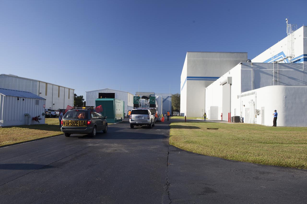 The Magnetospheric Multiscale spacecraft, enclosed in a protective shipping container, arrive at Building 2 of the Astrotech payload processing facility in Titusville, Florida, near Kennedy Space Center. MMS is a Solar Terrestrial Probes mission comprising four identically instrumented spacecraft that will use Earth’s magnetosphere as a laboratory to study the microphysics of three fundamental plasma processes: magnetic reconnection, energetic particle acceleration and turbulence. Launch aboard a United Launch Alliance Atlas V rocket from Space Launch Complex 41 on Cape Canaveral Air Force Station is targeted for March 12, 2015. 
