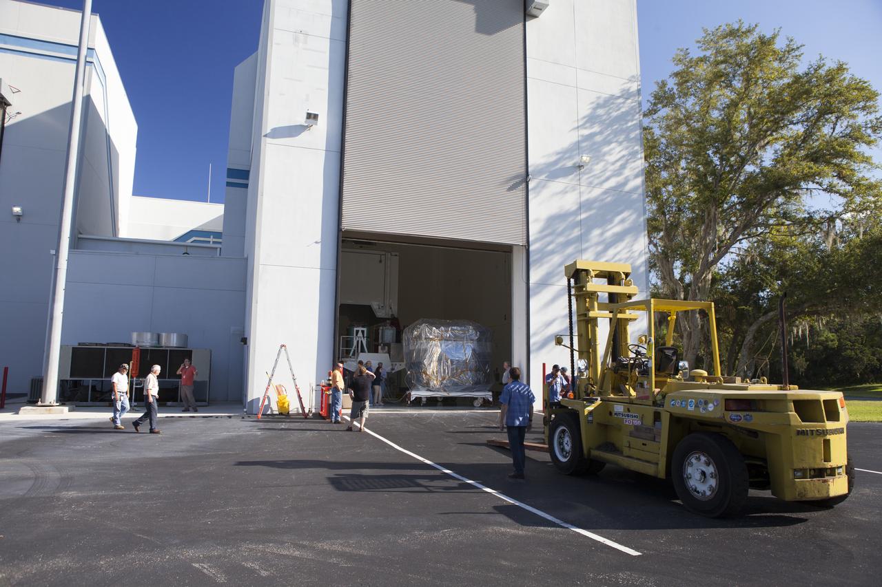 Preparations are underway to tow two of the observatories, the lower stack, mini-stack number 1, for NASA's Magnetospheric Multiscale Observatory, or MMS, from the Building 2 south encapsulation bay to the Building 1 high bay at the Astrotech payload processing facility in Titusville, Florida, near Kennedy Space Center. The MMS upper stack, mini-stack number 2, is scheduled to arrive in about two weeks. MMS is a Solar Terrestrial Probes mission comprising four identically instrumented spacecraft that will use Earth’s magnetosphere as a laboratory to study the microphysics of three fundamental plasma processes: magnetic reconnection, energetic particle acceleration and turbulence. Launch aboard a United Launch Alliance Atlas V rocket from Space Launch Complex 41 on Cape Canaveral Air Force Station is targeted for March 12, 2015.