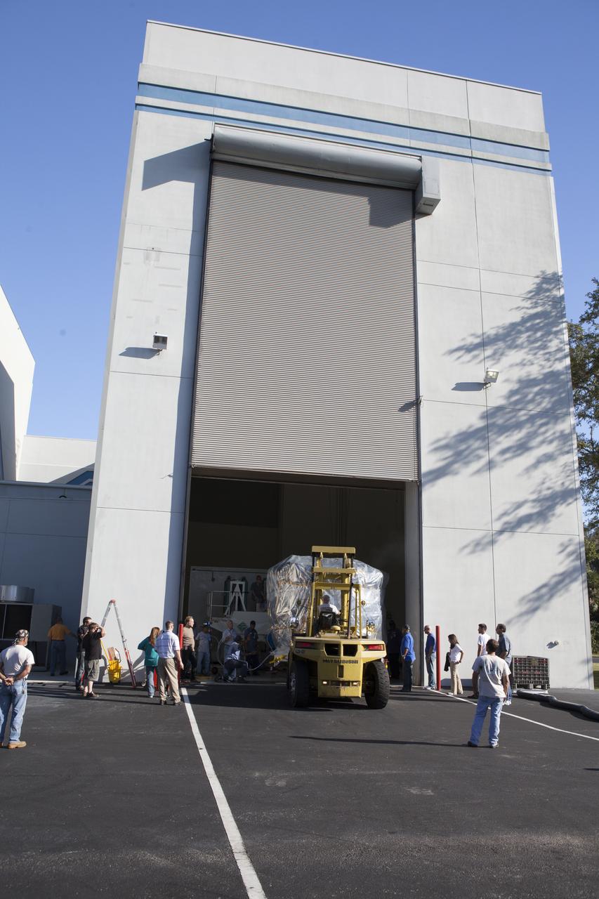 Two of the observatories for NASA's Magnetospheric Multiscale Observatory, or MMS, the lower stack, mini-stack number 1, begin the trip from the Building 2 south encapsulation bay to the Building 1 high bay at the Astrotech payload processing facility in Titusville, Florida, near Kennedy Space Center. The MMS upper stack, mini-stack number 2, is scheduled to arrive in about two weeks. MMS is a Solar Terrestrial Probes mission comprising four identically instrumented spacecraft that will use Earth’s magnetosphere as a laboratory to study the microphysics of three fundamental plasma processes: magnetic reconnection, energetic particle acceleration and turbulence. Launch aboard a United Launch Alliance Atlas V rocket from Space Launch Complex 41 on Cape Canaveral Air Force Station is targeted for March 12, 2015. 