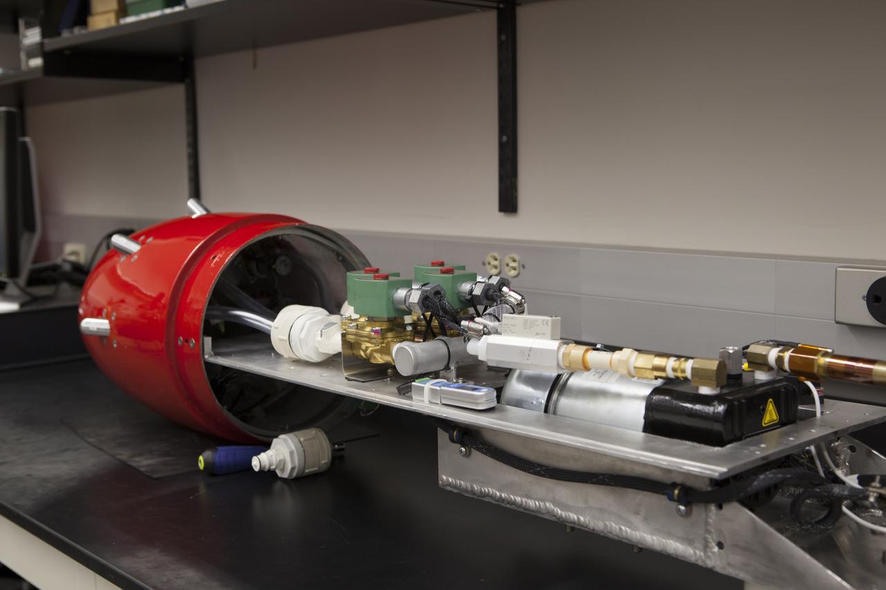 The Dust Atmospheric Recovery Technology, or DART, spacecraft is being assembled in a laboratory inside the Space Life Sciences Lab at NASA’s Kennedy Space Center in Florida.   DART will characterize the dust loading and microbial diversity in the atmosphere over Florida during summer months with a special emphasis on their interactions during an African dust storm. DART will be used to collect atmospheric aerosols and suspended microbial cells over Florida and Kennedy. Results will help predict the risks of excessive microbial contamination adhering to spacecraft surfaces. 