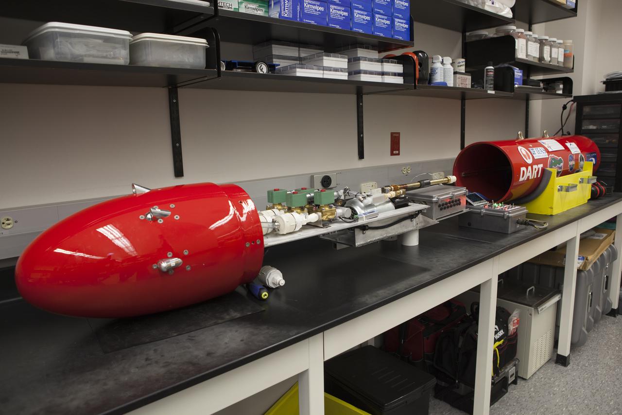 The Dust Atmospheric Recovery Technology, or DART, spacecraft is being assembled in a laboratory inside the Space Life Sciences Lab at NASA’s Kennedy Space Center in Florida. DART will characterize the dust loading and microbial diversity in the atmosphere over Florida during summer months with a special emphasis on their interactions during an African dust storm. DART will be used to collect atmospheric aerosols and suspended microbial cells over Florida and Kennedy. Results will help predict the risks of excessive microbial contamination adhering to spacecraft surfaces. 