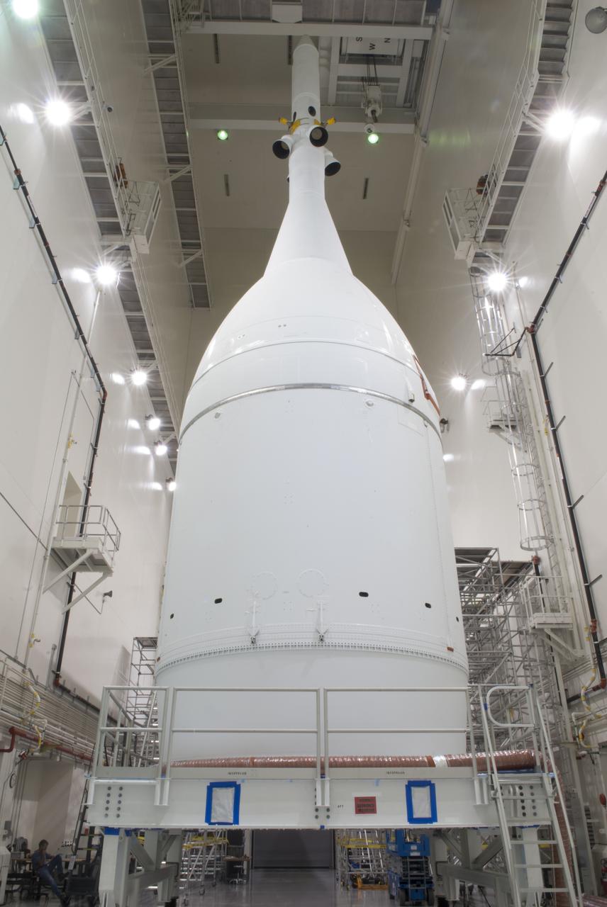 The Orion spacecraft sits inside the Launch Abort System Facility at NASA's Kennedy Space Center in Florida. The Ogive panels have been installed around the launch abort system. The panels will smooth the airflow over the conical spacecraft to limit sound and vibration, which will make for a much smoother ride for the astronauts who will ride inside Orion in the future. The spacecraft is being readied for its move to Space Launch Complex 37 at Cape Canaveral Air Force Station for its flight test. Orion is the exploration spacecraft designed to carry astronauts to destinations not yet explored by humans, including an asteroid and Mars. It will have emergency abort capability, sustain the crew during space travel and provide safe re-entry from deep space return velocities. The first unpiloted flight test of Orion is scheduled to launch in December 2014 atop a United Launch Alliance Delta IV Heavy rocket, and in 2018 on NASA’s Space Launch System rocket.