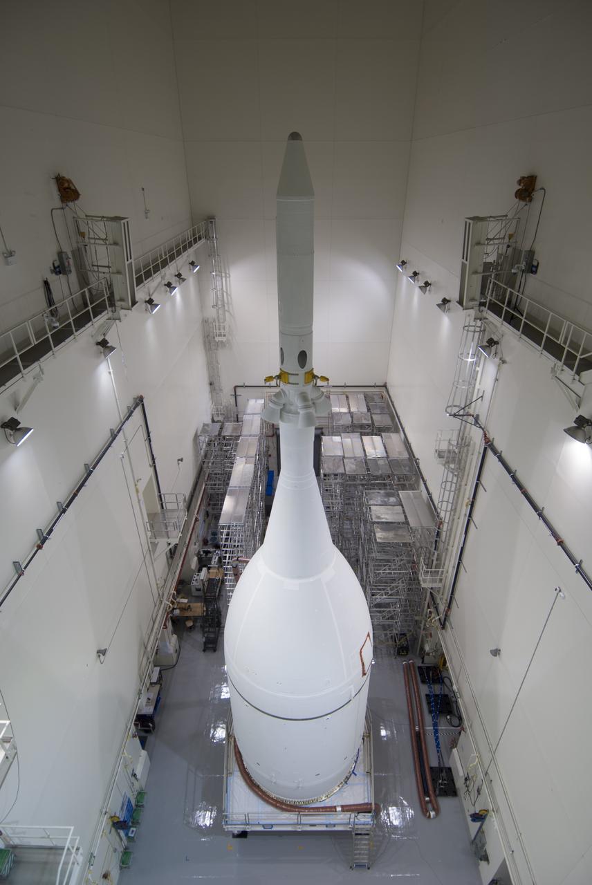 The Orion spacecraft sits inside the Launch Abort System Facility at NASA's Kennedy Space Center in Florida. The Ogive panels have been installed around the launch abort system. The panels will smooth the airflow over the conical spacecraft to limit sound and vibration, which will make for a much smoother ride for the astronauts who will ride inside Orion in the future. The spacecraft is being readied for its move to Space Launch Complex 37 at Cape Canaveral Air Force Station for its flight test. Orion is the exploration spacecraft designed to carry astronauts to destinations not yet explored by humans, including an asteroid and Mars. It will have emergency abort capability, sustain the crew during space travel and provide safe re-entry from deep space return velocities. The first unpiloted flight test of Orion is scheduled to launch in December 2014 atop a United Launch Alliance Delta IV Heavy rocket, and in 2018 on NASA’s Space Launch System rocket. 