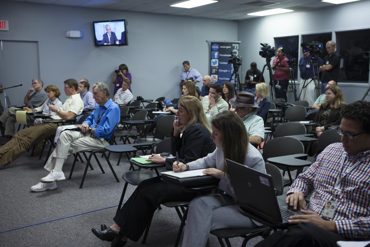 In the Kennedy Space Center’s Press Site auditorium, members of the news media listen as NASA and contractor officials plans for the upcoming Orion flight test. Orion is the exploration spacecraft designed to carry astronauts to destinations not yet explored by humans, including an asteroid and Mars. It will have emergency abort capability, sustain the crew during space travel and provide safe re-entry from deep space return velocities. The first unpiloted flight test of Orion is scheduled to launch Dec. 4, 2014 atop a United Launch Alliance Delta IV Heavy rocket, and in 2018 on NASA’s Space Launch System rocket.