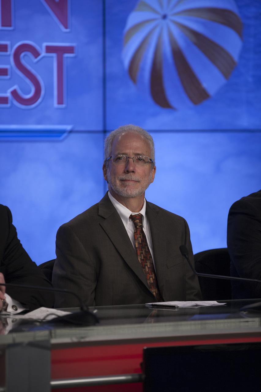 In the Kennedy Space Center’s Press Site auditorium, members of the news media are briefed on the upcoming Orion flight test by Mark Geyer, NASA Orion Program manager. Orion is the exploration spacecraft designed to carry astronauts to destinations not yet explored by humans, including an asteroid and Mars. It will have emergency abort capability, sustain the crew during space travel and provide safe re-entry from deep space return velocities. The first unpiloted flight test of Orion is scheduled to launch Dec. 4, 2014 atop a United Launch Alliance Delta IV Heavy rocket, and in 2018 on NASA’s Space Launch System rocket.
