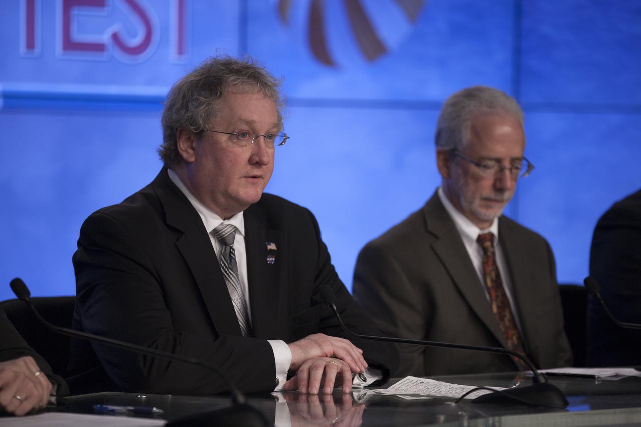 In the Kennedy Space Center’s Press Site auditorium, members of the news media are briefed on the upcoming Orion flight test by Bill Hill, NASA deputy associate administrator for Exploration Systems Development. Mark Geyer, NASA Orion Program manager, is on the right. Orion is the exploration spacecraft designed to carry astronauts to destinations not yet explored by humans, including an asteroid and Mars. It will have emergency abort capability, sustain the crew during space travel and provide safe re-entry from deep space return velocities. The first unpiloted flight test of Orion is scheduled to launch Dec. 4, 2014 atop a United Launch Alliance Delta IV Heavy rocket, and in 2018 on NASA’s Space Launch System rocket.