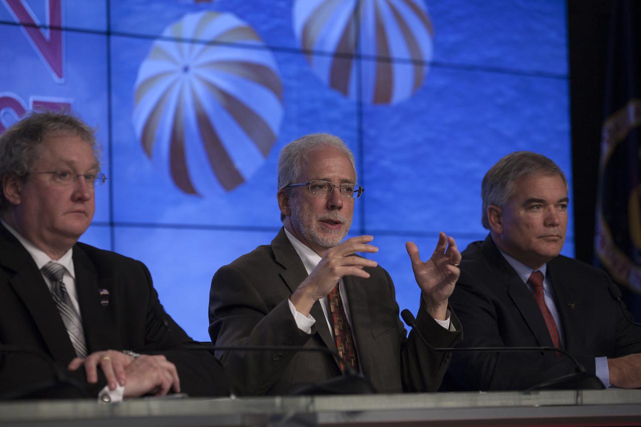 In the Kennedy Space Center’s Press Site auditorium, members of the news media are briefed on the upcoming Orion flight test by Mark Geyer, NASA Orion Program manager. Also participating in the news conference are Bill Hill, NASA deputy associate administrator for Exploration Systems Development, left, and Bryan Austin, Lockheed Martin mission manager. Orion is the exploration spacecraft designed to carry astronauts to destinations not yet explored by humans, including an asteroid and Mars. It will have emergency abort capability, sustain the crew during space travel and provide safe re-entry from deep space return velocities. The first unpiloted flight test of Orion is scheduled to launch Dec. 4, 2014 atop a United Launch Alliance Delta IV Heavy rocket, and in 2018 on NASA’s Space Launch System rocket.