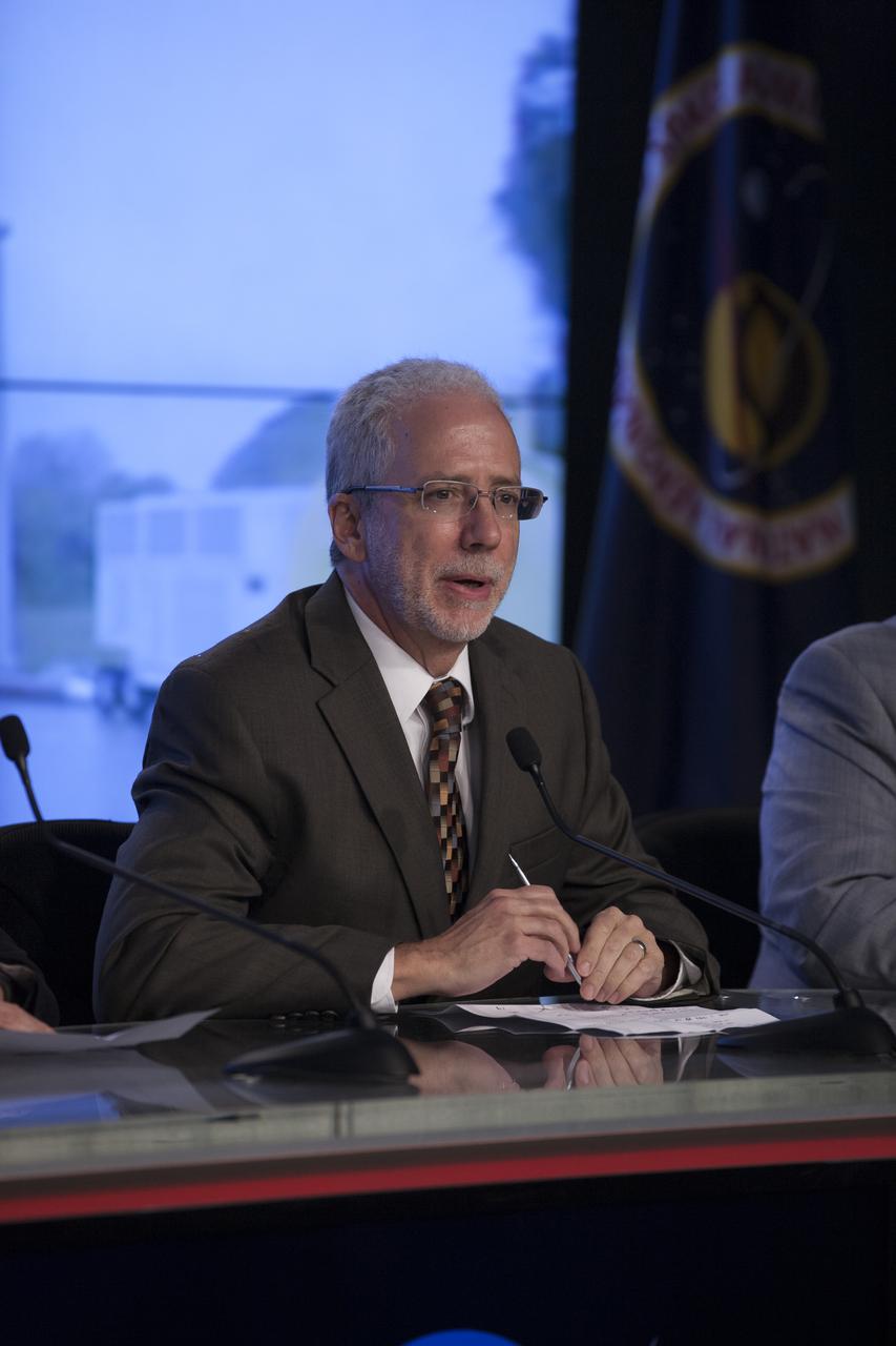In the Kennedy Space Center’s Press Site auditorium, NASA Orion Program manager Mark Geyer spoke to members of the news media as the completed Orion spacecraft was being prepared for its trip from the Launch Abort System Facility to Launch Complex 37 at Cape Canaveral Air Force Station. Orion is the exploration spacecraft designed to carry astronauts to destinations not yet explored by humans, including an asteroid and Mars. It will have emergency abort capability, sustain the crew during space travel and provide safe re-entry from deep space return velocities. The first unpiloted flight test of Orion is scheduled to launch Dec. 4, 2014 atop a United Launch Alliance Delta IV Heavy rocket, and in 2018 on NASA’s Space Launch System rocket.