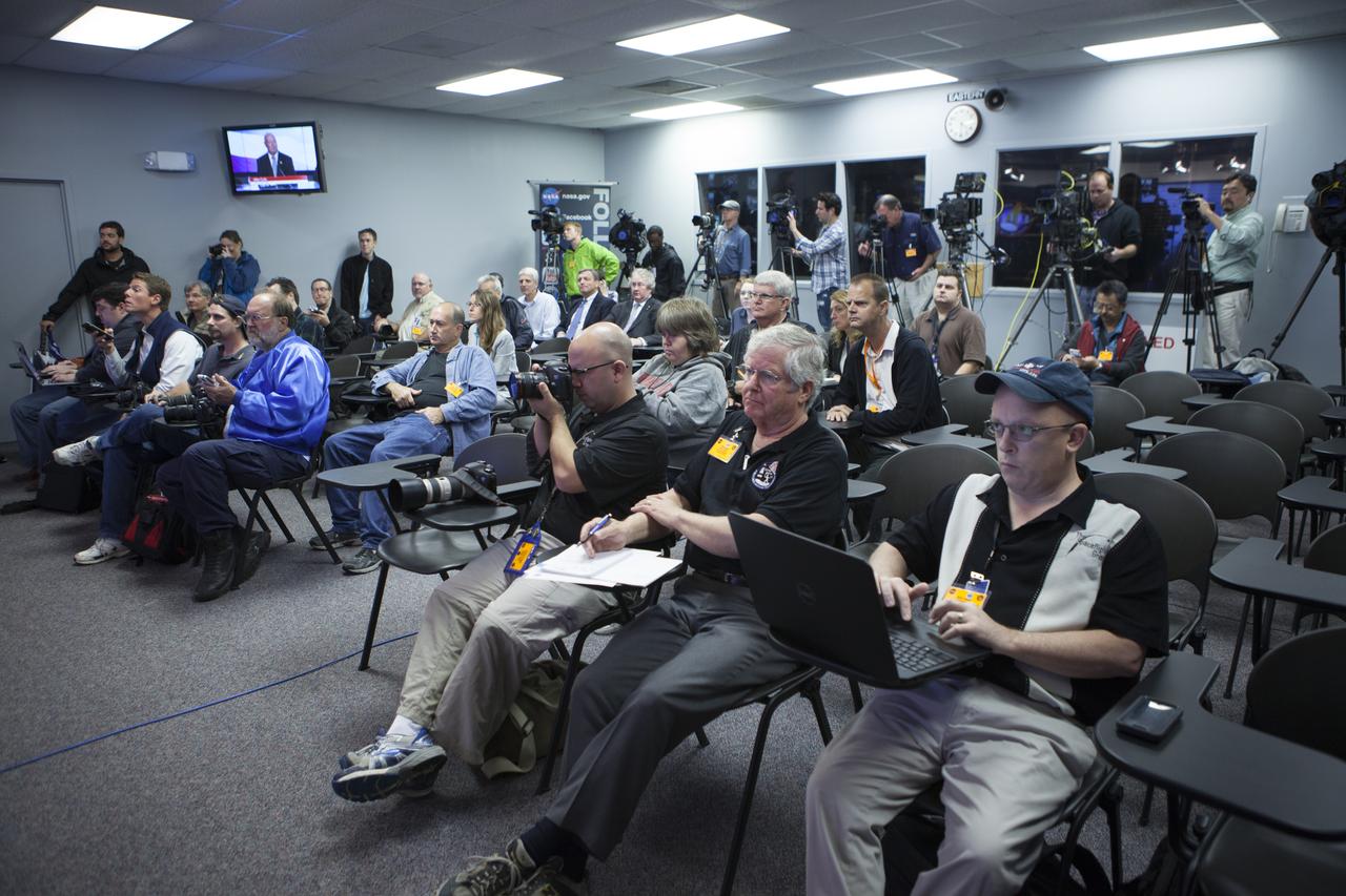 In the Kennedy Space Center’s Press Site auditorium, members of the news media listen as NASA and contractor officials discuss plans for moving the completed Orion spacecraft from the Launch Abort System Facility to Launch Complex 37 at Cape Canaveral Air Force Station. Orion is the exploration spacecraft designed to carry astronauts to destinations not yet explored by humans, including an asteroid and Mars. It will have emergency abort capability, sustain the crew during space travel and provide safe re-entry from deep space return velocities. The first unpiloted flight test of Orion is scheduled to launch Dec. 4, 2014 atop a United Launch Alliance Delta IV Heavy rocket, and in 2018 on NASA’s Space Launch System rocket.