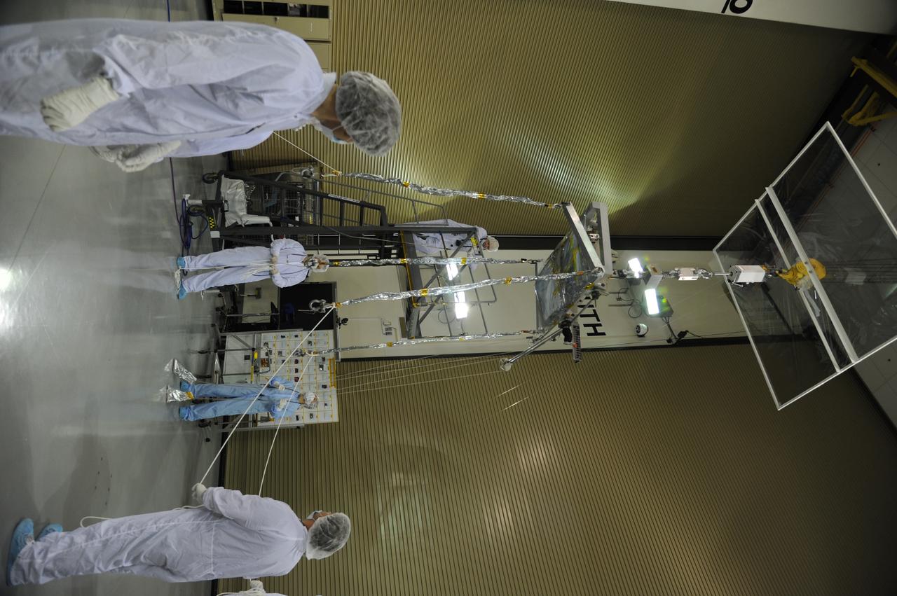 Operations are underway to weigh NASA's Soil Moisture Active Passive, or SMAP, spacecraft in the clean room of the Astrotech payload processing facility on Vandenberg Air Force Base in California. The weighing of a spacecraft is standard procedure during prelaunch processing. SMAP will launch on a Delta II 7320 configuration vehicle featuring a United Launch Alliance first stage booster powered by an Aerojet Rocketdyne RS-27A main engine and three Alliant Techsystems, or ATK, strap-on solid rocket motors. Once on station in Earth orbit, SMAP will provide global measurements of soil moisture and its freeze/thaw state. NASA's Jet Propulsion Laboratory that built the observatory and its radar instrument also is responsible for SMAP project management and mission operations. Launch from Space Launch Complex 2 is targeted for Jan. 29, 2015.