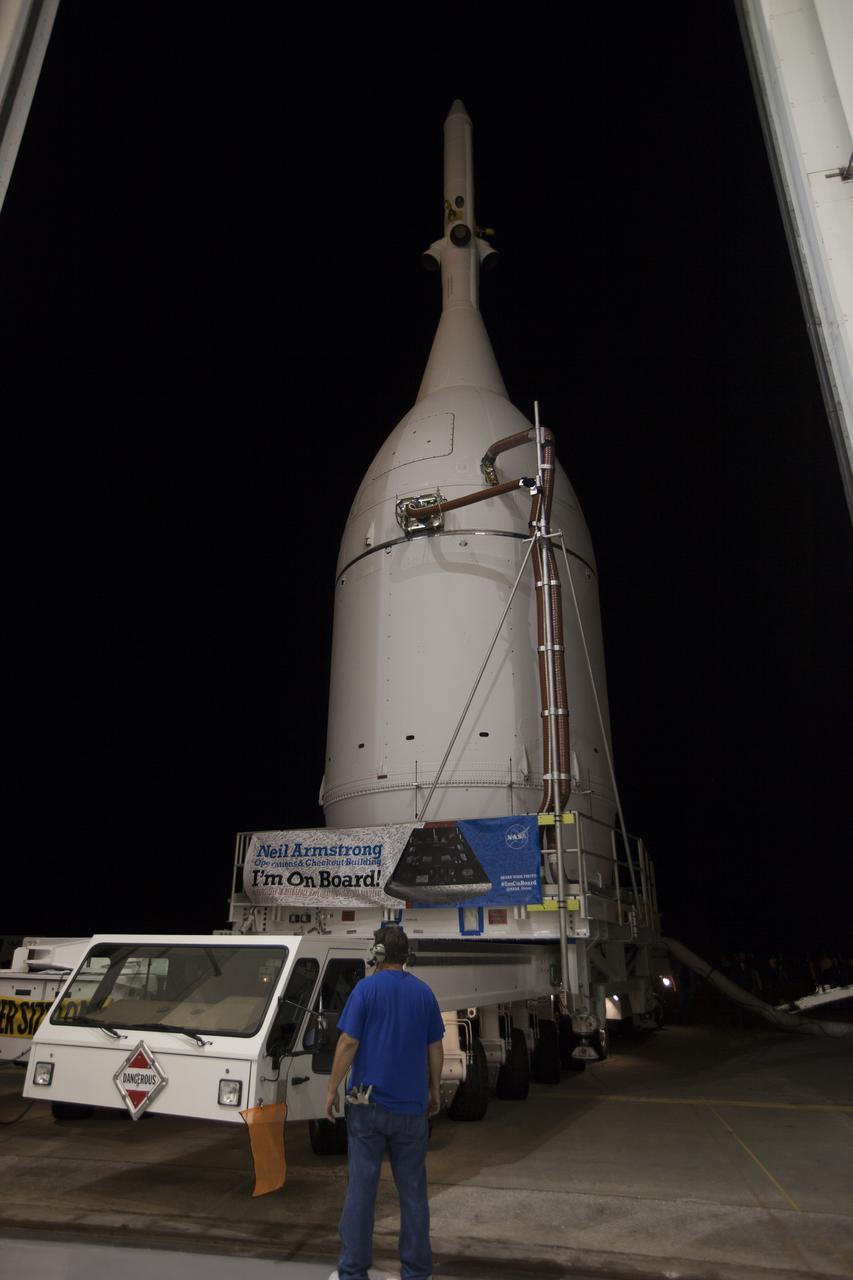 At NASA's Kennedy Space Center in Florida, the agency's completed Orion spacecraft begins its trip from the Launch Abort System Facility to Launch Complex 37 at Cape Canaveral Air Force Station. Orion spent many months in Kennedy's Neil Armstrong Operations and Checkout Building undergoing final assembly. Hundreds of employees who work there signed the banner that states, "I'm On Board!" In doing so, their signature indicated they did their part to ensure mission success. After arrival at the launch pad, United Launch Alliance engineers and technicians will lift Orion and mount it atop its Delta IV Heavy rocket. Orion is the exploration spacecraft designed to carry astronauts to destinations not yet explored by humans, including an asteroid and Mars. It will have emergency abort capability, sustain the crew during space travel and provide safe re-entry from deep space return velocities. The first unpiloted flight test of Orion is scheduled to launch Dec. 4, 2014 atop a United Launch Alliance Delta IV Heavy rocket, and in 2018 on NASA’s Space Launch System rocket.