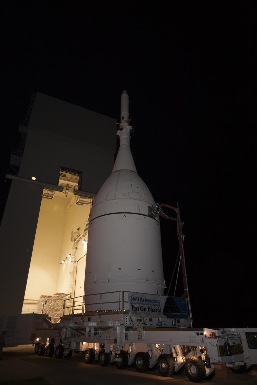 At NASA's Kennedy Space Center in Florida, the agency's completed Orion spacecraft begins its trip from the Launch Abort System Facility to Launch Complex 37 at Cape Canaveral Air Force Station. Orion spent many months in Kennedy's Neil Armstrong Operations and Checkout Building undergoing final assembly. Hundreds of employees who work there signed the banner that states, "I'm On Board!" In doing so, their signature indicated they did their part to ensure mission success. After arrival at the launch pad, United Launch Alliance engineers and technicians will lift Orion and mount it atop its Delta IV Heavy rocket. Orion is the exploration spacecraft designed to carry astronauts to destinations not yet explored by humans, including an asteroid and Mars. It will have emergency abort capability, sustain the crew during space travel and provide safe re-entry from deep space return velocities. The first unpiloted flight test of Orion is scheduled to launch Dec. 4, 2014 atop a United Launch Alliance Delta IV Heavy rocket, and in 2018 on NASA’s Space Launch System rocket.