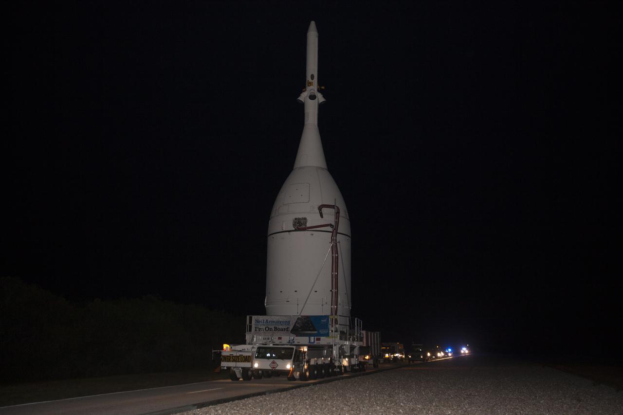 At NASA's Kennedy Space Center in Florida, the agency's Orion spacecraft approaches the spaceport's Launch Complex 39B as it is transported to Launch Complex 37 at Cape Canaveral Air Force Station. After arrival at the launch pad, United Launch Alliance engineers and technicians will lift Orion and mount it atop its Delta IV Heavy rocket. Orion is the exploration spacecraft designed to carry astronauts to destinations not yet explored by humans, including an asteroid and Mars. It will have emergency abort capability, sustain the crew during space travel and provide safe re-entry from deep space return velocities. The first unpiloted flight test of Orion is scheduled to launch Dec. 4, 2014 atop a United Launch Alliance Delta IV Heavy rocket, and in 2018 on NASA’s Space Launch System rocket. 