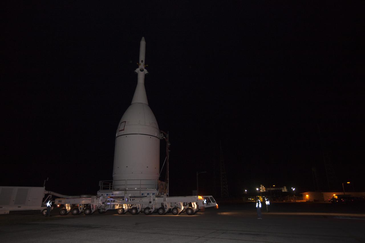 At NASA's Kennedy Space Center in Florida, the agency's Orion spacecraft passes the spaceport's Launch Complex 39B as it is transported to Launch Complex 37 at Cape Canaveral Air Force Station. After arrival at the launch pad, United Launch Alliance engineers and technicians will lift Orion and mount it atop its Delta IV Heavy rocket. Orion is the exploration spacecraft designed to carry astronauts to destinations not yet explored by humans, including an asteroid and Mars. It will have emergency abort capability, sustain the crew during space travel and provide safe re-entry from deep space return velocities. The first unpiloted flight test of Orion is scheduled to launch Dec. 4, 2014 atop a United Launch Alliance Delta IV Heavy rocket, and in 2018 on NASA’s Space Launch System rocket.