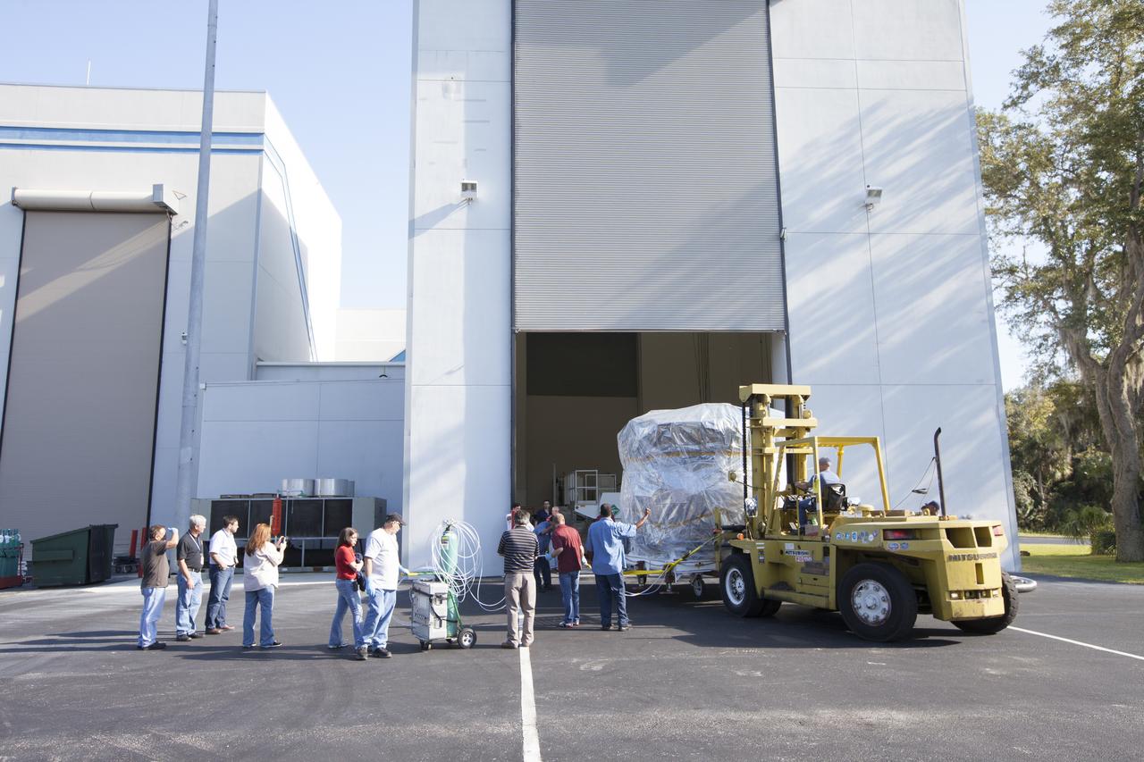 Two Magnetospheric Multiscale, or MMS, spacecraft comprising the mission’s upper stack are towed from Building 2 to the Building 1 high bay of the Astrotech payload processing facility in Titusville, Florida, near Kennedy Space Center. The two MMS spacecraft comprising the lower stack arrived at Astrotech on Oct. 29. The Magnetospheric Multiscale mission is a Solar Terrestrial Probes mission comprising four identically instrumented spacecraft that will use Earth’s magnetosphere as a laboratory to study the microphysics of three fundamental plasma processes: magnetic reconnection, energetic particle acceleration and turbulence. Launch aboard a United Launch Alliance Atlas V rocket from Space Launch Complex 41 on Cape Canaveral Air Force Station is targeted for March 12, 2015.