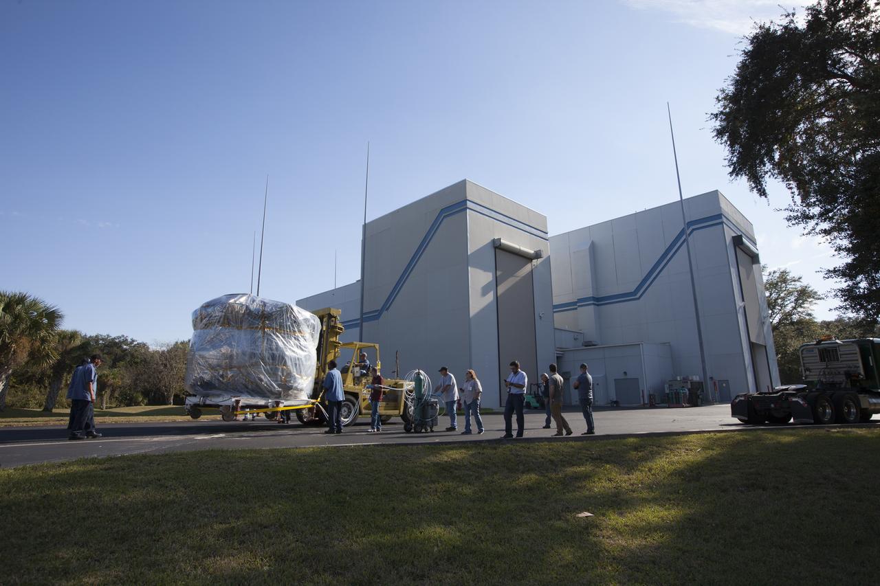 Two Magnetospheric Multiscale, or MMS, spacecraft comprising the mission’s upper stack are towed between Buildings 1 and 2 of the Astrotech payload processing facility in Titusville, Florida, near Kennedy Space Center. The two MMS spacecraft comprising the lower stack arrived at Astrotech on Oct. 29. The Magnetospheric Multiscale mission is a Solar Terrestrial Probes mission comprising four identically instrumented spacecraft that will use Earth’s magnetosphere as a laboratory to study the microphysics of three fundamental plasma processes: magnetic reconnection, energetic particle acceleration and turbulence. Launch aboard a United Launch Alliance Atlas V rocket from Space Launch Complex 41 on Cape Canaveral Air Force Station is targeted for March 12, 2015.