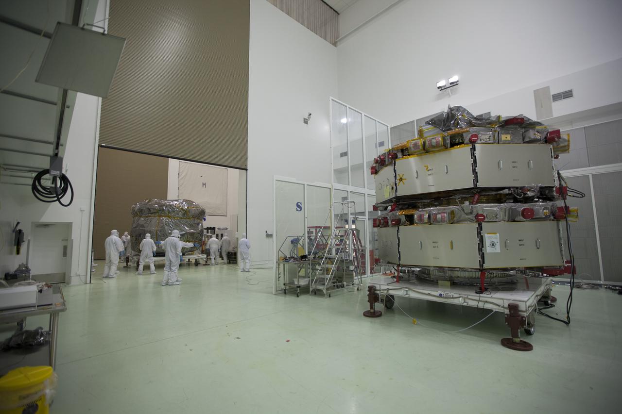 Two Magnetospheric Multiscale, or MMS, spacecraft comprising the mission’s upper stack arrive in the Building 1 airlock of the Astrotech payload processing facility in Titusville, Florida, near Kennedy Space Center. The two MMS spacecraft comprising the lower stack, in the high bay uat right, arrived at Astrotech on Oct. 29. The Magnetospheric Multiscale mission is a Solar Terrestrial Probes mission comprising four identically instrumented spacecraft that will use Earth’s magnetosphere as a laboratory to study the microphysics of three fundamental plasma processes: magnetic reconnection, energetic particle acceleration and turbulence. Launch aboard a United Launch Alliance Atlas V rocket from Space Launch Complex 41 on Cape Canaveral Air Force Station is targeted for March 12, 2015. 