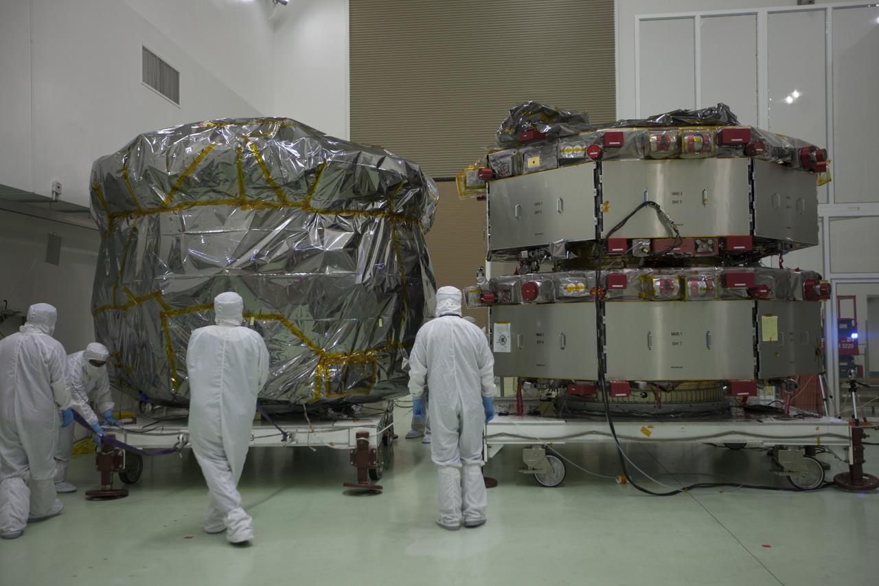 Two Magnetospheric Multiscale, or MMS, spacecraft comprising the mission’s upper stack, at left, arrive in the Building 1 high bay of the Astrotech payload processing facility in Titusville, Florida, near Kennedy Space Center. The two MMS spacecraft comprising the lower stack, at right, arrived at Astrotech on Oct. 29. The Magnetospheric Multiscale mission is a Solar Terrestrial Probes mission comprising four identically instrumented spacecraft that will use Earth’s magnetosphere as a laboratory to study the microphysics of three fundamental plasma processes: magnetic reconnection, energetic particle acceleration and turbulence. Launch aboard a United Launch Alliance Atlas V rocket from Space Launch Complex 41 on Cape Canaveral Air Force Station is targeted for March 12, 2015.