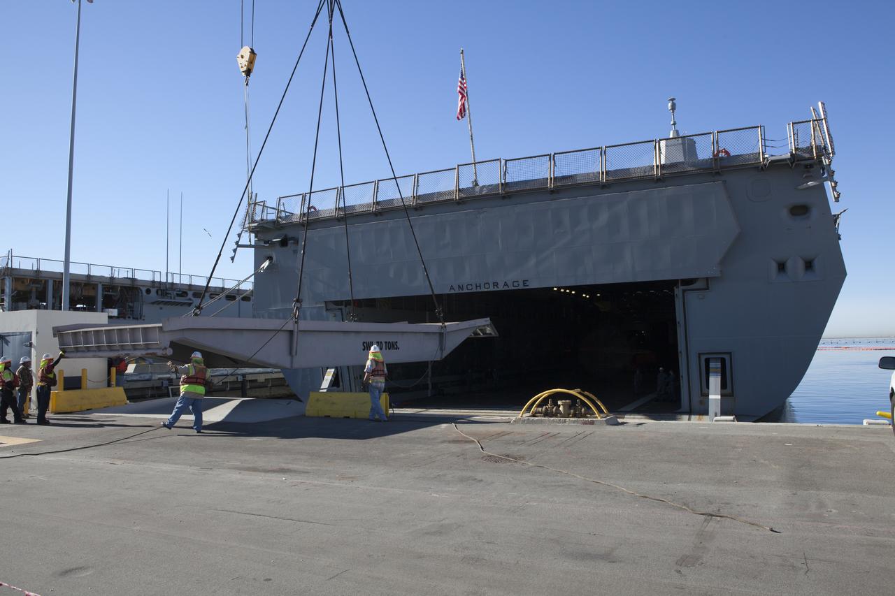 A ramp is being loaded on the USS Anchorage so that ground support equipment for use during recovery of the Orion crew module after its first flight test can be loaded into the well deck of the ship at Naval Base San Diego in California. Before launch of Orion on a Delta IV Heavy rocket from Cape Canaveral Air Force Station in Florida, NASA, Lockheed Martin and U.S. Navy personnel will head out to sea in the USS Anchorage and the USNS Salvor, a salvage ship, and wait for splashdown of the Orion crew module in the Pacific Ocean. The Ground Systems Development and Operations Program will lead the recovery efforts. Orion is the exploration spacecraft designed to carry astronauts to destinations not yet explored by humans, including an asteroid and Mars. It will have emergency abort capability, sustain the crew during space travel and provide safe re-entry from deep space return velocities. The first unpiloted flight test of Orion is scheduled to launch in December atop a United Launch Alliance Delta IV Heavy rocket and in 2018 on NASA’s Space Launch System rocket. 