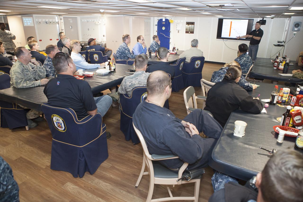 NASA Orion Recovery Director Jeremy Graeber, with the Ground Systems Development and Operations Program at Kennedy Space Center in Florida, reviews Orion recovery procedures with NASA, Lockheed Martin and U.S. Navy personnel aboard the USS Anchorage at Naval Base San Diego in California. Before the launch of Orion on its first flight test atop a Delta IV Heavy rocket from Cape Canaveral Air Force Station in Florida, NASA, Lockheed Martin and U.S. Navy personnel will head out to sea in the USS Anchorage and the USNS Salvor, a salvage ship, and wait for splashdown of the Orion crew module in the Pacific Ocean. The GSDO Program will lead the recovery efforts. Orion is the exploration spacecraft designed to carry astronauts to destinations not yet explored by humans, including an asteroid and Mars. It will have emergency abort capability, sustain the crew during space travel and provide safe re-entry from deep space return velocities. The first unpiloted flight test of Orion is scheduled to launch in December atop a United Launch Alliance Delta IV Heavy rocket and in 2018 on NASA’s Space Launch System rocket. 