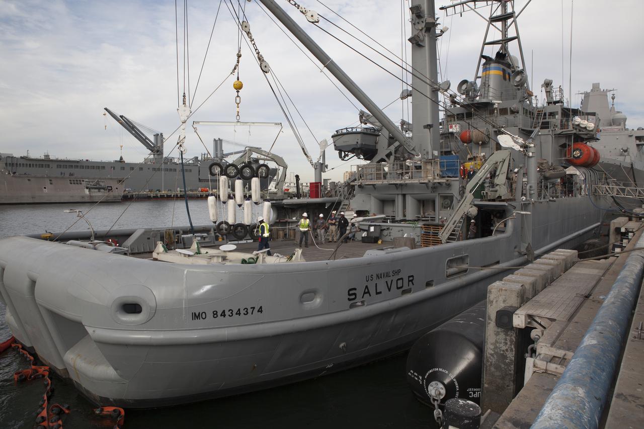 Ground support equipment for use during an alternate recovery method of the Orion crew module after its first flight test, if needed, is lowered by crane onto the deck of the USNS Salvor, a salvage ship, at Naval Base San Diego in California. Before launch of Orion on a Delta IV Heavy rocket from Cape Canaveral Air Force Station in Florida, NASA, Lockheed Martin and U.S. Navy personnel will head out to sea in the USS Anchorage and the USNS Salvor and wait for splashdown of the Orion crew module in the Pacific Ocean. The GSDO Program will lead the recovery efforts. Orion is the exploration spacecraft designed to carry astronauts to destinations not yet explored by humans, including an asteroid and Mars. It will have emergency abort capability, sustain the crew during space travel and provide safe re-entry from deep space return velocities. The first unpiloted flight test of Orion is scheduled to launch in December atop a United Launch Alliance Delta IV Heavy rocket and in 2018 on NASA’s Space Launch System rocket. 