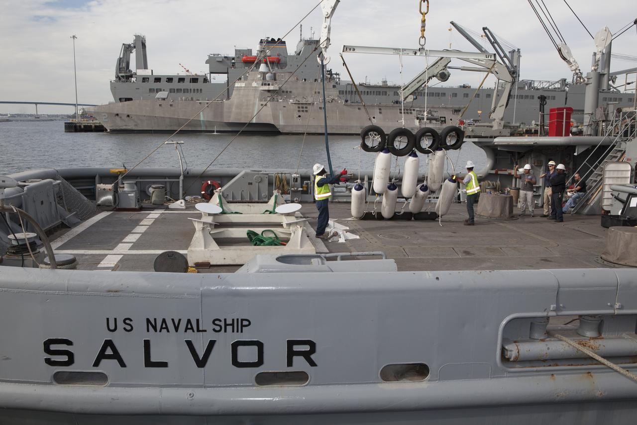 Ground support equipment for use during an alternate recovery method of the Orion crew module after its first flight test, if needed, is lowered by crane onto the deck of the USNS Salvor, a salvage ship, at Naval Base San Diego in California. Before launch of Orion on a Delta IV Heavy rocket from Cape Canaveral Air Force Station in Florida, NASA, Lockheed Martin and U.S. Navy personnel will head out to sea in the USS Anchorage and the USNS Salvor and wait for splashdown of the Orion crew module in the Pacific Ocean. The GSDO Program will lead the recovery efforts. Orion is the exploration spacecraft designed to carry astronauts to destinations not yet explored by humans, including an asteroid and Mars. It will have emergency abort capability, sustain the crew during space travel and provide safe re-entry from deep space return velocities. The first unpiloted flight test of Orion is scheduled to launch in December atop a United Launch Alliance Delta IV Heavy rocket and in 2018 on NASA’s Space Launch System rocket.