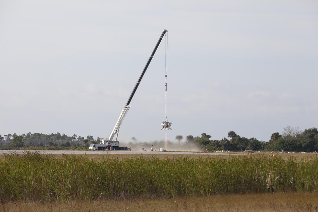 NASA's Project Morpheus prototype lander's engine fires briefly in a tethered-flight test at the north end of the Shuttle Landing Facility at NASA’s Kennedy Space Center in Florida. However, the test was stopped following detection of an anomaly immediately after engine ignition. The tether test was cut short due to Morpheus exceeding onboard abort rate limits. The vehicle was taken back to the hangar and data from the test is being studied. After review, managers will determine when a new test date will be set. The landing facility provides the lander with the kind of field necessary for realistic testing, complete with rocks, craters and hazards to avoid. Morpheus’ ALHAT payload allows it to navigate to clear landing sites amidst rocks, craters and other hazards during its descent.