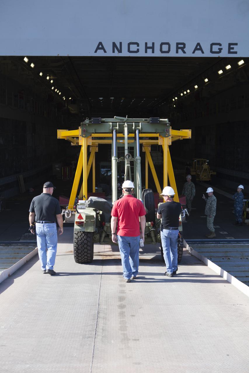 The Orion crew module recovery fixture is being loaded into the well deck of the USS Anchorage at Naval Base San Diego in California. The equipment will be used during recovery of the Orion crew module after its first flight test. Before launch of Orion on a Delta IV Heavy rocket from Cape Canaveral Air Force Station in Florida, NASA, Lockheed Martin and U.S. Navy personnel will head out to sea in the USS Anchorage and the USNS Salvor, a salvage ship, and wait for splashdown of the Orion crew module in the Pacific Ocean. The Ground Systems Development and Operations Program will lead the recovery efforts. Orion is the exploration spacecraft designed to carry astronauts to destinations not yet explored by humans, including an asteroid and Mars. It will have emergency abort capability, sustain the crew during space travel and provide safe re-entry from deep space return velocities. The first unpiloted flight test of Orion is scheduled to launch in December atop a United Launch Alliance Delta IV Heavy rocket and in 2018 on NASA’s Space Launch System rocket. 