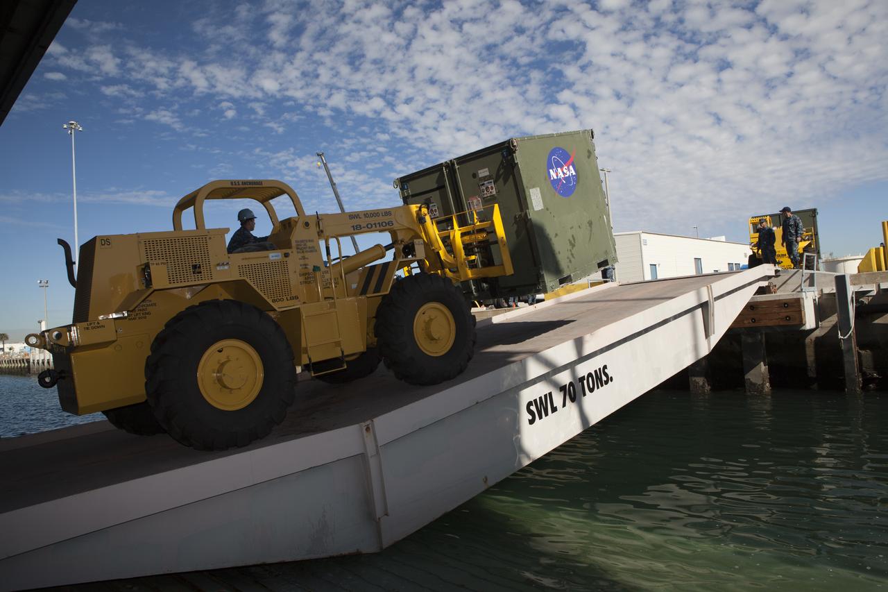 A forklift is used to carry ground support equipment into the well deck of the USS Anchorage at Naval Base San Diego in California. The equipment will be used during recovery of the Orion crew module after its first flight test. Before launch of Orion on a Delta IV Heavy rocket from Cape Canaveral Air Force Station in Florida, NASA, Lockheed Martin and U.S. Navy personnel will head out to sea in the USS Anchorage and the USNS Salvor, a salvage ship, and wait for splashdown of the Orion crew module in the Pacific Ocean. The Ground Systems Development and Operations Program will lead the recovery efforts. Orion is the exploration spacecraft designed to carry astronauts to destinations not yet explored by humans, including an asteroid and Mars. It will have emergency abort capability, sustain the crew during space travel and provide safe re-entry from deep space return velocities. The first unpiloted flight test of Orion is scheduled to launch in December atop a United Launch Alliance Delta IV Heavy rocket and in 2018 on NASA’s Space Launch System rocket.