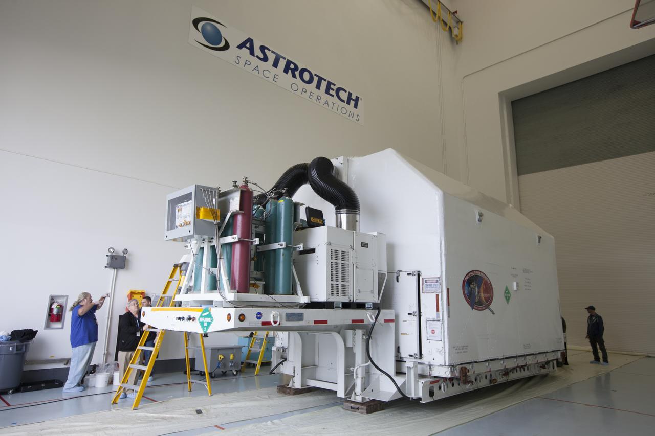 Preparations are underway to remove a protective shipping container from around NOAA’s Deep Space Climate Observatory spacecraft, or DSCOVR, at the Astrotech payload processing facility in Titusville, Florida, near Kennedy Space Center. DSCOVR is a partnership between NOAA, NASA and the U.S. Air Force. DSCOVR will maintain the nation's real-time solar wind monitoring capabilities which are critical to the accuracy and lead time of NOAA's space weather alerts and forecasts. Launch is currently scheduled for January 2015 aboard a SpaceX Falcon 9 v 1.1 launch vehicle from Cape Canaveral Air Force Station, Florida. 