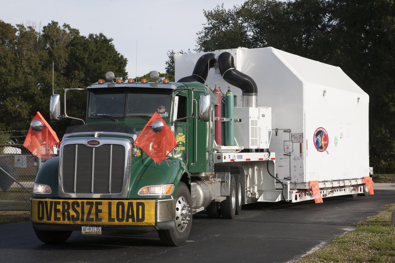 NOAA’s Deep Space Climate Observatory spacecraft, or DSCOVR, enclosed in a protective shipping container, is delivered by truck to the Astrotech payload processing facility in Titusville, Florida, near Kennedy Space Center. DSCOVR is a partnership between NOAA, NASA and the U.S. Air Force. DSCOVR will maintain the nation's real-time solar wind monitoring capabilities which are critical to the accuracy and lead time of NOAA's space weather alerts and forecasts. Launch is currently scheduled for January 2015 aboard a SpaceX Falcon 9 v 1.1 launch vehicle from Cape Canaveral Air Force Station, Florida. 