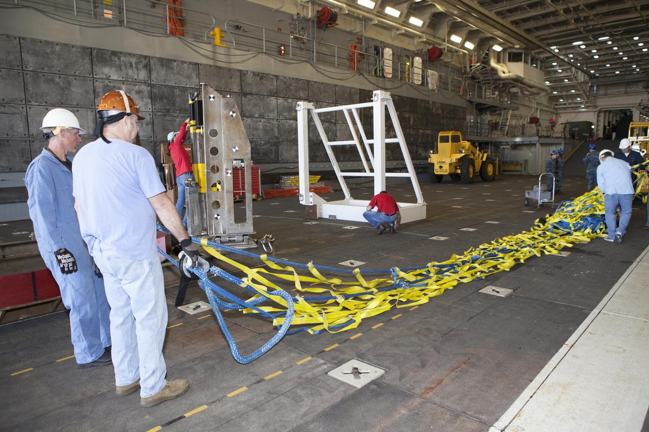 Ground support equipment is being secured in the well deck of the USS Anchorage at Naval Base San Diego in California. The equipment will be used during recovery of the Orion crew module after its first flight test. Before launch of Orion on a Delta IV Heavy rocket from Cape Canaveral Air Force Station in Florida, NASA, Lockheed Martin and U.S. Navy personnel will head out to sea in the USS Anchorage and the USNS Salvor, a salvage ship, and wait for splashdown of the Orion crew module in the Pacific Ocean. The Ground Systems Development and Operations Program will lead the recovery efforts. Orion is the exploration spacecraft designed to carry astronauts to destinations not yet explored by humans, including an asteroid and Mars. It will have emergency abort capability, sustain the crew during space travel and provide safe re-entry from deep space return velocities. The first unpiloted flight test of Orion is scheduled to launch in December atop a United Launch Alliance Delta IV Heavy rocket and in 2018 on NASA’s Space Launch System rocket.