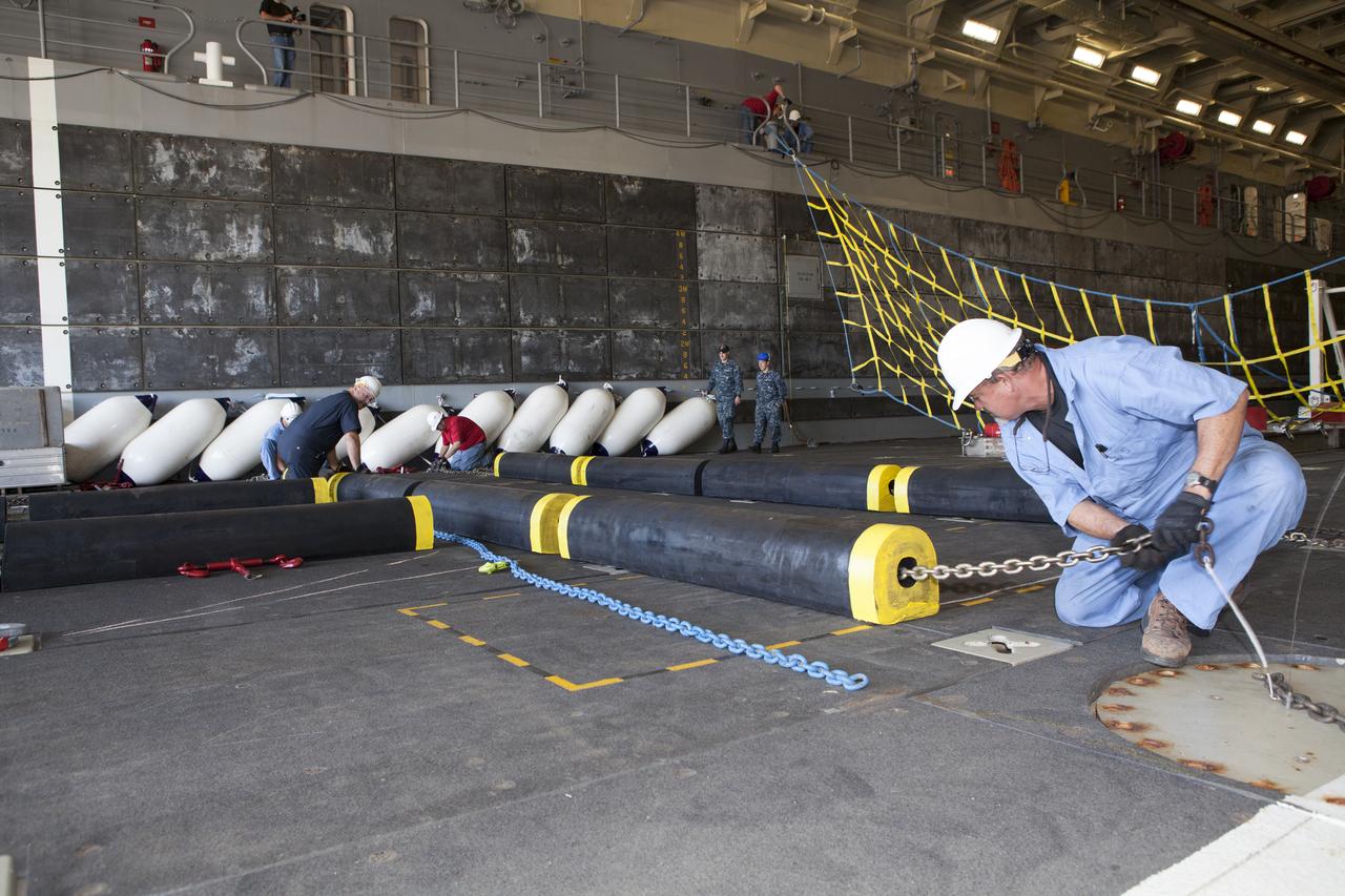 Ground support equipment is being secured in the well deck of the USS Anchorage at Naval Base San Diego in California. The equipment will be used during recovery of the Orion crew module after its first flight test. Before launch of Orion on a Delta IV Heavy rocket from Cape Canaveral Air Force Station in Florida, NASA, Lockheed Martin and U.S. Navy personnel will head out to sea in the USS Anchorage and the USNS Salvor, a salvage ship, and wait for splashdown of the Orion crew module in the Pacific Ocean. The Ground Systems Development and Operations Program will lead the recovery efforts. Orion is the exploration spacecraft designed to carry astronauts to destinations not yet explored by humans, including an asteroid and Mars. It will have emergency abort capability, sustain the crew during space travel and provide safe re-entry from deep space return velocities. The first unpiloted flight test of Orion is scheduled to launch in December atop a United Launch Alliance Delta IV Heavy rocket and in 2018 on NASA’s Space Launch System rocket.