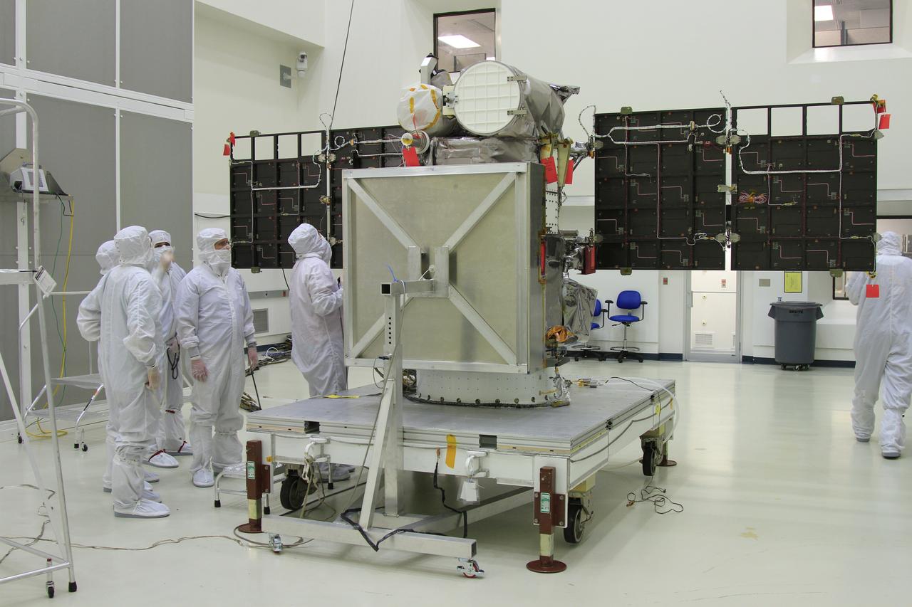 The solar arrays on NOAA’s Deep Space Climate Observatory spacecraft, or DSCOVR, are unfurled in the Building 1 high bay at the Astrotech payload processing facility in Titusville, Florida, near Kennedy Space Center. DSCOVR is a partnership between NOAA, NASA and the U.S. Air Force. DSCOVR will maintain the nation's real-time solar wind monitoring capabilities which are critical to the accuracy and lead time of NOAA's space weather alerts and forecasts. Launch is targeted for early 2015 aboard a SpaceX Falcon 9 v 1.1 launch vehicle from Cape Canaveral Air Force Station, Florida.