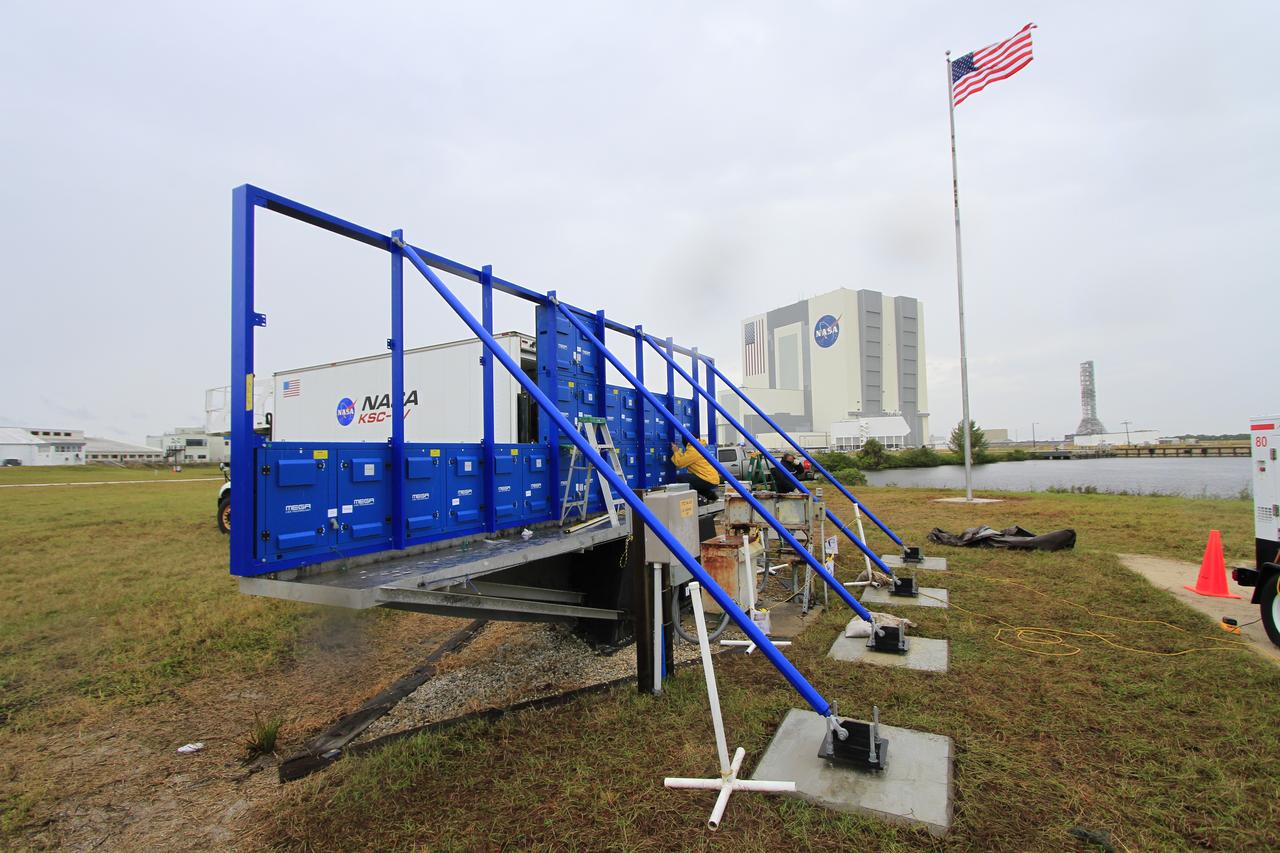 At NASA's Kennedy Space Center in Florida, work continues to install 24 light emitting diode LED panels in the new countdown clock at the spaceport's Press Site. The modern, multimedia display is similar to the screens seen at sporting venues. The new screen will be nearly 26 feet wide by 7 feet high, a foot taller than the original clock. The historic countdown clock was designed by Kennedy engineers and built by space center technicians before Apollo 12 in 1969. NASA has requested to acquire the countdown clock from the agency’s Artifact Working Group at the agency's Headquarters for likely display at the Kennedy Space Center Visitor Complex. 