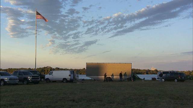 At NASA's Kennedy Space Center in Florida, the new countdown clock at the spaceport's Press Site is being tested. The modern, multimedia display is similar to the screens seen at sporting venues. The new screen will be nearly 26 feet wide by 7 feet high, a foot taller than the original clock. The historic countdown clock was designed by Kennedy engineers and built by space center technicians before Apollo 12 in 1969. NASA has requested to acquire the countdown clock from the agency’s Artifact Working Group at the agency's Headquarters for display at the Kennedy Space Center Visitor Complex. 