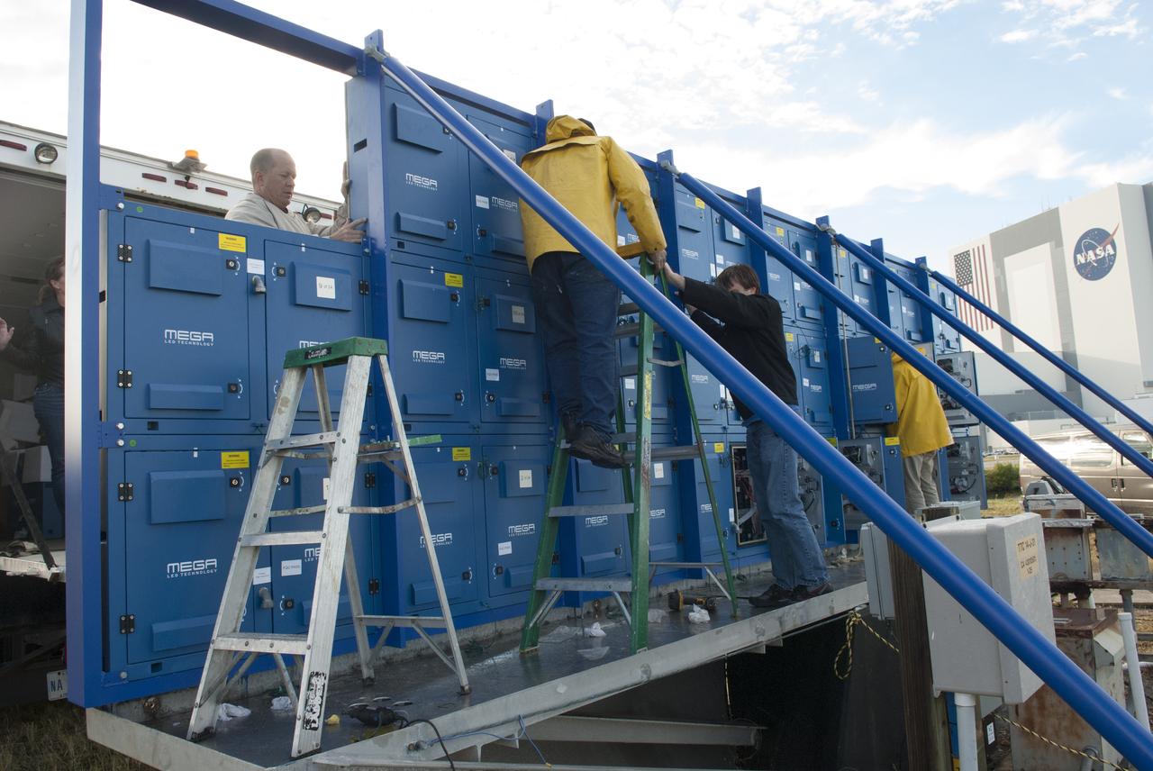 At NASA's Kennedy Space Center in Florida, work continues to install 24 light emitting diode LED panels in the new countdown clock at the spaceport's Press Site. The modern, multimedia display is similar to the screens seen at sporting venues. The new screen will be nearly 26 feet wide by 7 feet high, a foot taller than the original clock. The historic countdown clock was designed by Kennedy engineers and built by space center technicians before Apollo 12 in 1969. NASA has requested to acquire the countdown clock from the agency’s Artifact Working Group at the agency's Headquarters for display at the Kennedy Space Center Visitor Complex. 