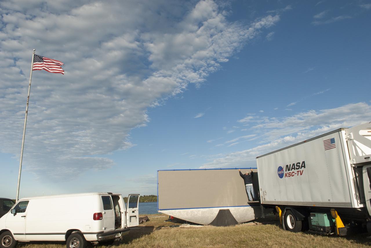 At NASA's Kennedy Space Center in Florida, work continues to install 24 light emitting diode LED panels in the new countdown clock at the spaceport's Press Site. The modern, multimedia display is similar to the screens seen at sporting venues. The new screen will be nearly 26 feet wide by 7 feet high, a foot taller than the original clock. The historic countdown clock was designed by Kennedy engineers and built by space center technicians before Apollo 12 in 1969. NASA has requested to acquire the countdown clock from the agency’s Artifact Working Group at the agency's Headquarters for display at the Kennedy Space Center Visitor Complex.