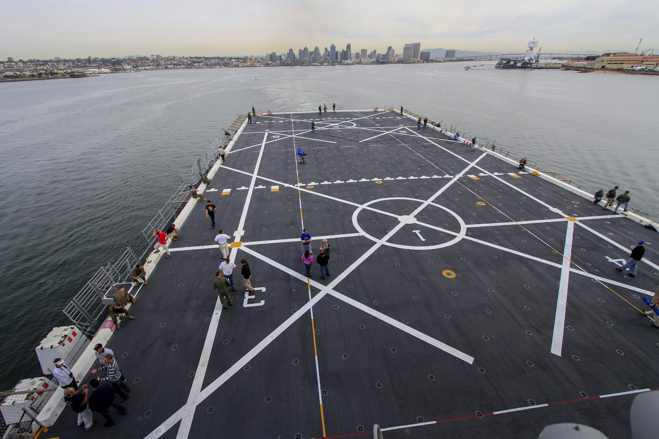 NASA and U.S. Navy personnel are on the deck of the USS Anchorage as the ship departs Naval Base San Diego and heads out to sea in the Pacific Ocean. NASA and the U.S. Navy are making preparations ahead of Orion's flight test for recovery of the crew module, forward bay cover and parachutes on its return from space and splashdown in the Pacific Ocean. The Ground Systems Development and Operations Program is leading the recovery efforts. 