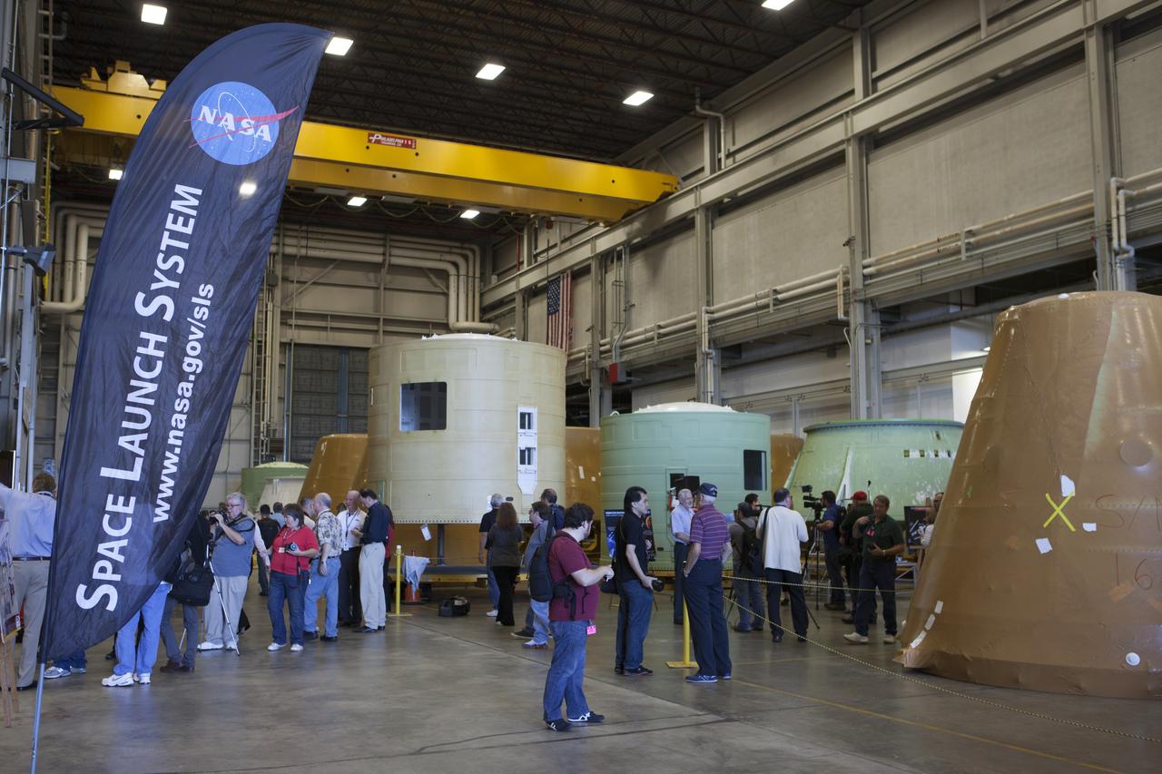 At NASA's Kennedy Space Center in Florida, members of the news media tour the spaceport's Booster Fabrication Facility BFF. During the Space Shuttle Program, the facility was used for processing forward segments and aft skirts for the solid rocket boosters. The BFF will serve a similar role for the SLS. Orion is the exploration spacecraft designed to carry astronauts to destinations not yet explored by humans, including an asteroid and Mars. It will have emergency abort capability, sustain the crew during space travel and provide safe re-entry from deep space return velocities. The first unpiloted flight test of Orion is scheduled to launch Dec. 4, 2014 atop a United Launch Alliance Delta IV Heavy rocket, and in 2018 on NASA’s Space Launch System rocket.