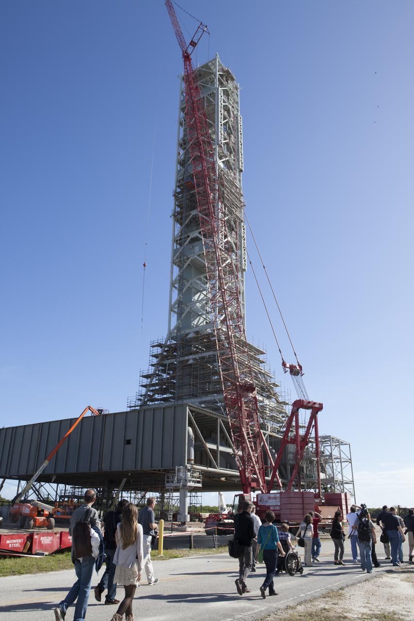 At NASA's Kennedy Space Center in Florida, members of the news media get an up-close look at the new mobile launcher. The Space Launch System rocket will be stacked on the launcher inside the Vehicle Assembly Building prior to rollout to Launch Pad 39B atop crawler-transporter 2. Orion is the exploration spacecraft designed to carry astronauts to destinations not yet explored by humans, including an asteroid and Mars. It will have emergency abort capability, sustain the crew during space travel and provide safe re-entry from deep space return velocities. The first unpiloted flight test of Orion is scheduled to launch Dec. 4, 2014 atop a United Launch Alliance Delta IV Heavy rocket, and in 2018 on NASA’s Space Launch System rocket. 