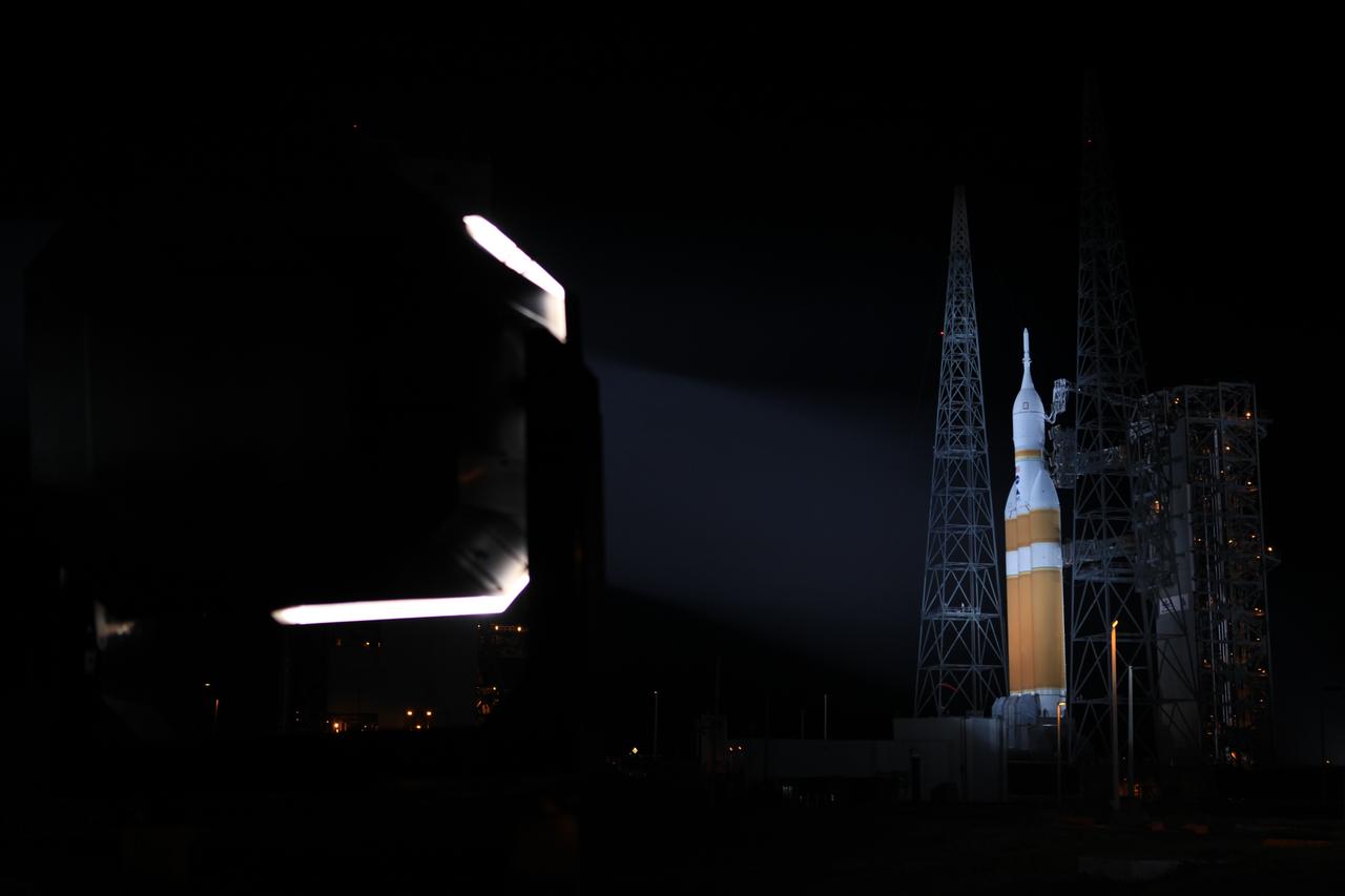 The launch gantry is rolled back to reveal NASA's Orion spacecraft mounted atop a United Launch Alliance Delta IV Heavy rocket at Cape Canaveral Air Force Station's Space Launch Complex 37. Orion is NASA’s new spacecraft built to carry humans, designed to allow us to journey to destinations never before visited by humans, including an asteroid and Mars.