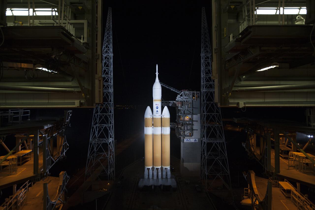 The launch gantry is rolled back to reveal NASA's Orion spacecraft mounted atop a United Launch Alliance Delta IV Heavy rocket at Cape Canaveral Air Force Station's Space Launch Complex 37. Orion is NASA’s new spacecraft built to carry humans, designed to allow us to journey to destinations never before visited by humans, including an asteroid and Mars.
