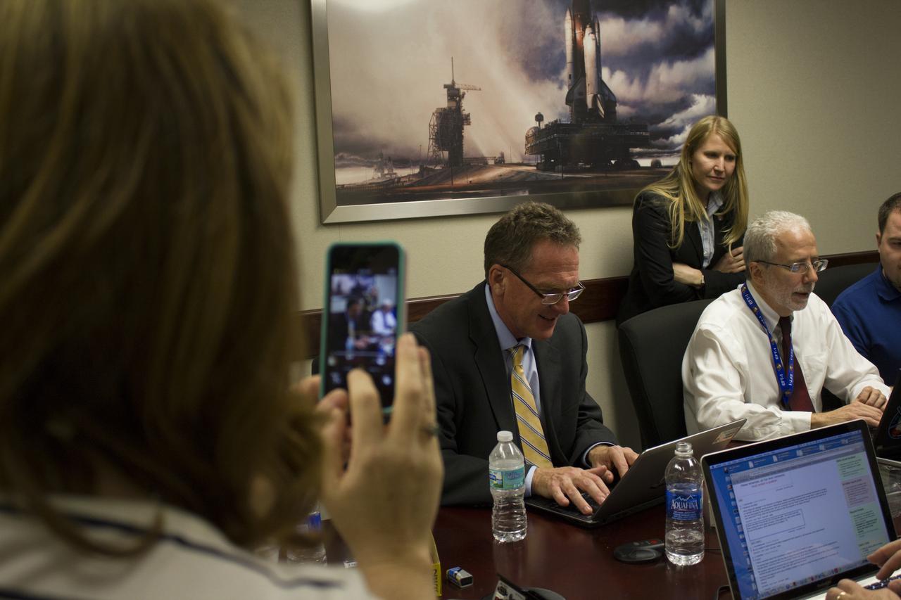 NASA managers participate in a live online Ask Me Anything, or AMA, session for reddit.com followers during Orion preflight activities at NASA Kennedy Space Center's News Center in Florida. From left, are Mike Bolger, Ground Systems Development and Operations program manager and Mark Geyer, Orion program manager. Also participating, but not shown in the photo is Todd May, Space Launch System program manager. Discussion topics include Mars and technology. 