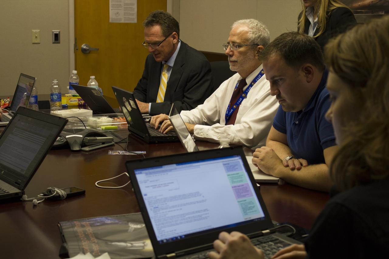 From left, Mike Bolger, Ground Systems Development and Operations program manager; and Mark Geyer, Orion program manager, participate in a live online Ask Me Anything, or AMA, session for reddit.com followers during Orion preflight activities at NASA Kennedy Space Center's News Center in Florida. Not shown is Todd May, Space Launch System program manager. Discussion topics include Mars and technology.